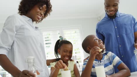 children with parents eating cookies