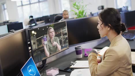 composition of asian businesswoman using computer and laptop with ai call on screen