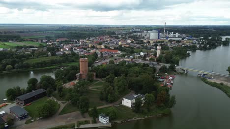 medieval-tower-on-island-on-lake-in-small-village-aerial-cloudy-day