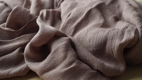 close-up of a draped brown fabric texture