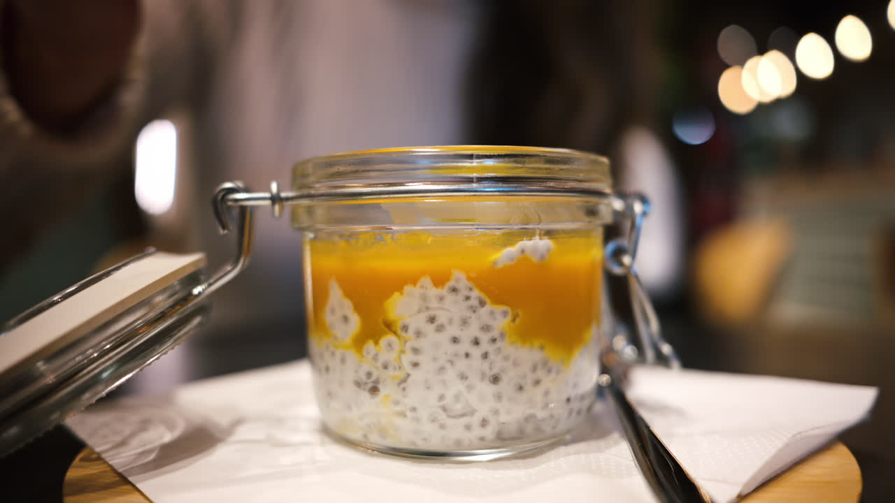 Coconut mango chia pudding in a glass jar