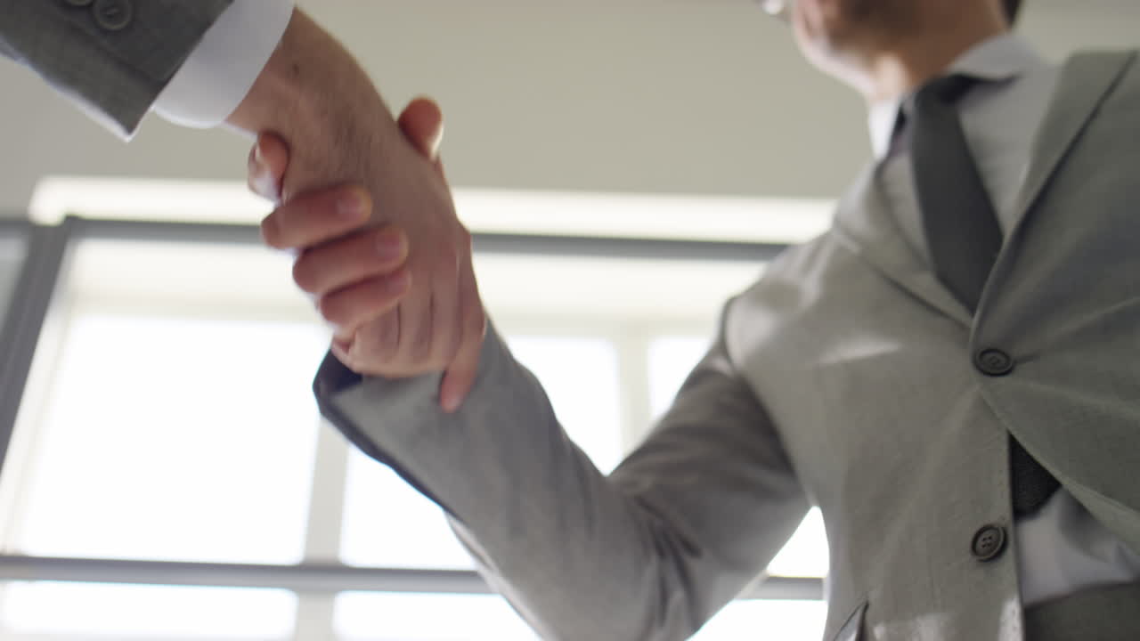 Low Angle View of Handshake of Businessmen