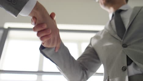 low angle view of handshake of businessmen