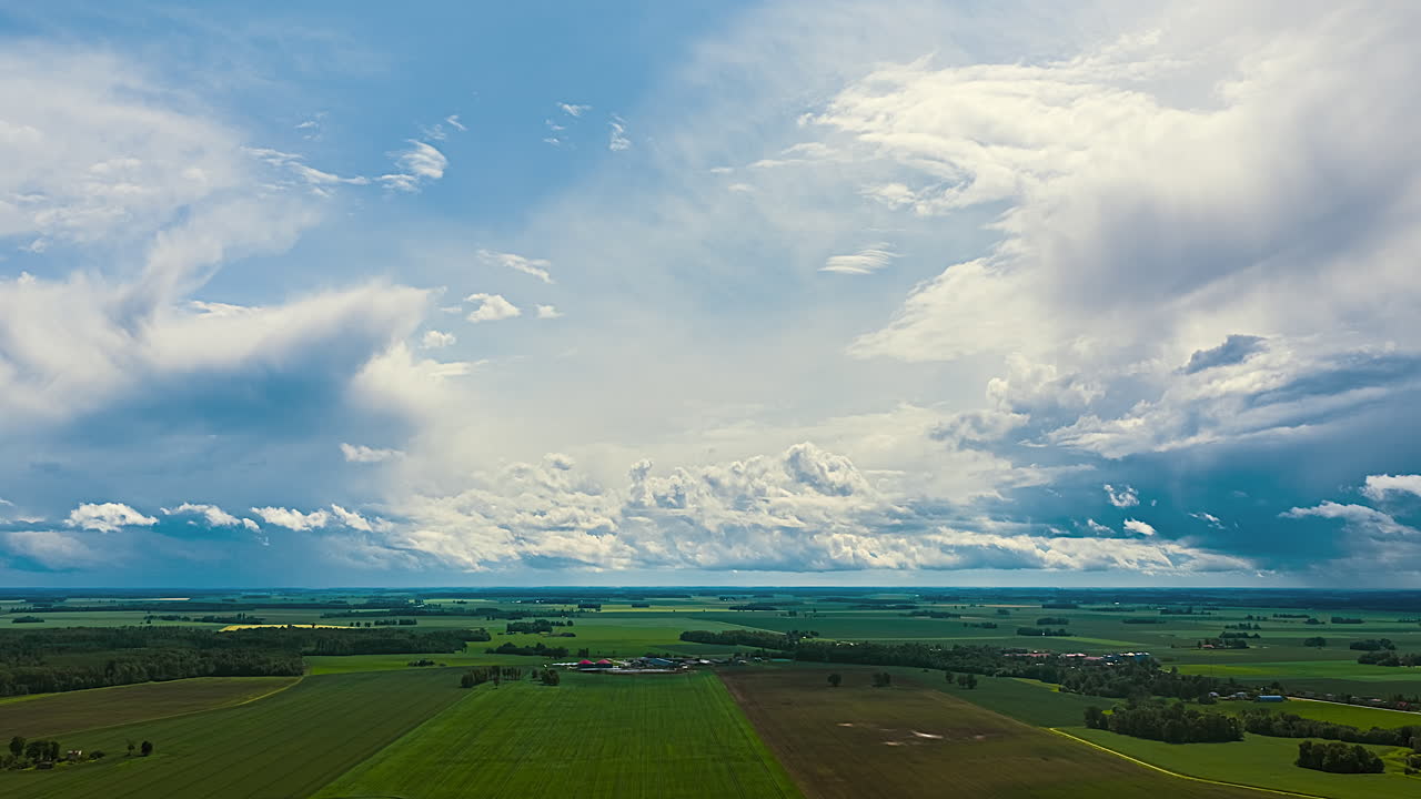 Vast fields and sweeping sky create peaceful and serene timelapse scene