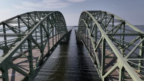 an aerial view of the great south bay bridge and the robert moses causeway on a beautiful day