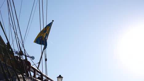 london canary wharf aug 2022 the götheborg of sweden's flag ripples in the wind