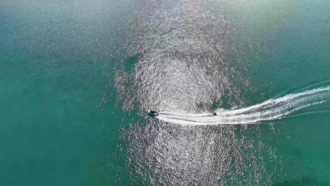 aerial view of jet ski on turquoise water