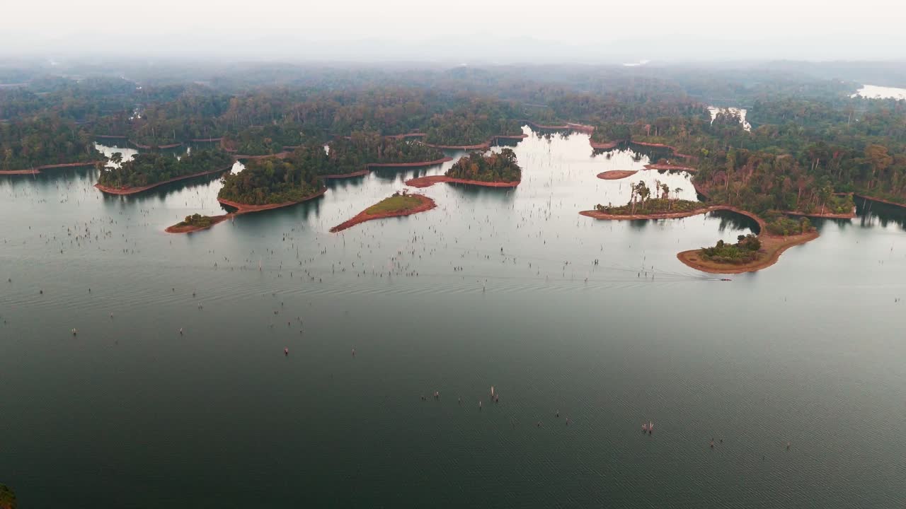 Stunning aerial footage of the islands and landscape of Thakhek loop, foggy sky, red sand, copy space
