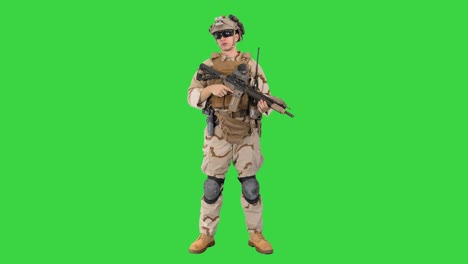 happy young soldier talking and smiling on a green screen, chroma key