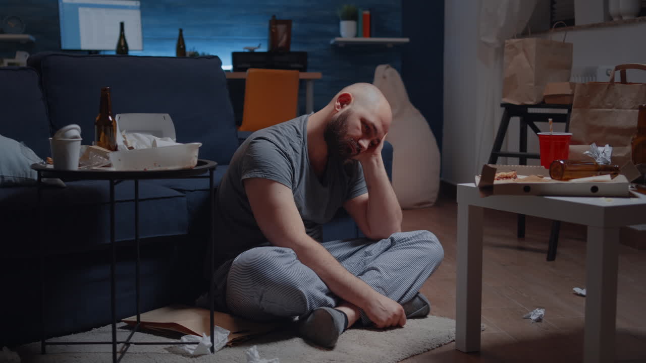 Vulnerable depressed man sitting alone feeling emotionally unstable