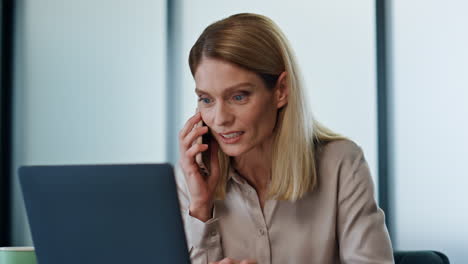 Excited-winner-calling-phone-at-corporate-office-closeup.-Excited-lady-talking