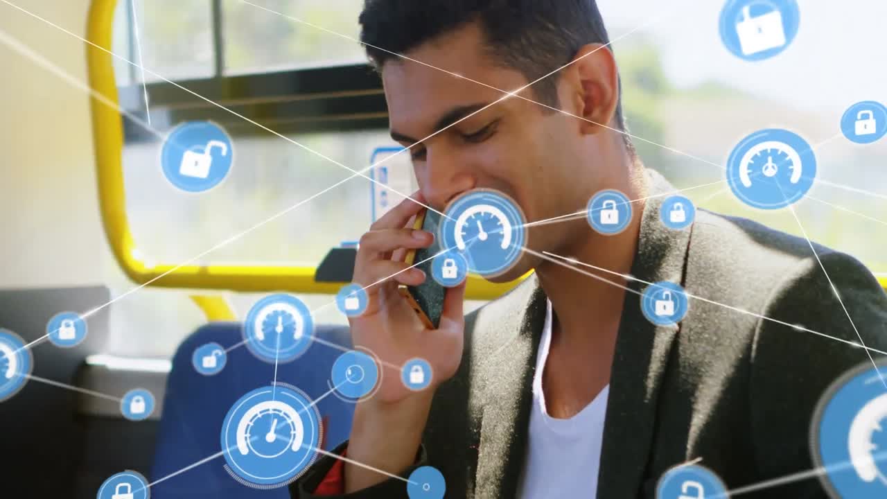 red de iconos digitales contra un hombre biracial hablando en un teléfono inteligente sentado en el autobús