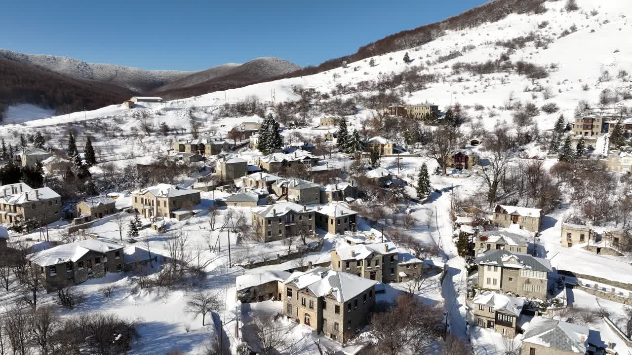 Aerial rotation movement over the city of Nymfaion during a harsh winter - Florina, Greece.