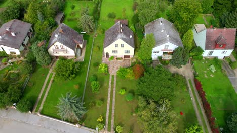 the sight of houses featuring eternit roof coverings in austria - aerial pullback