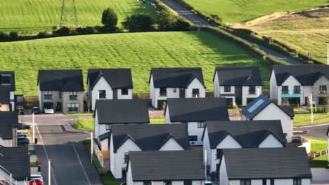 Aerial-panning-shot-showing-a-housing-estate-with-work-undergoing