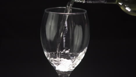 Hand-Pouring-a-Glass-of-Fresh-White-Wine-and-drinking-from-it