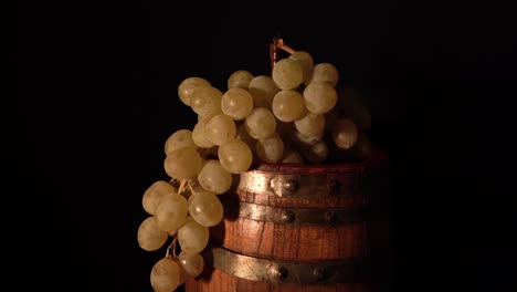 Closer-view-and-backward-rotating-wine-barrel-with-grape