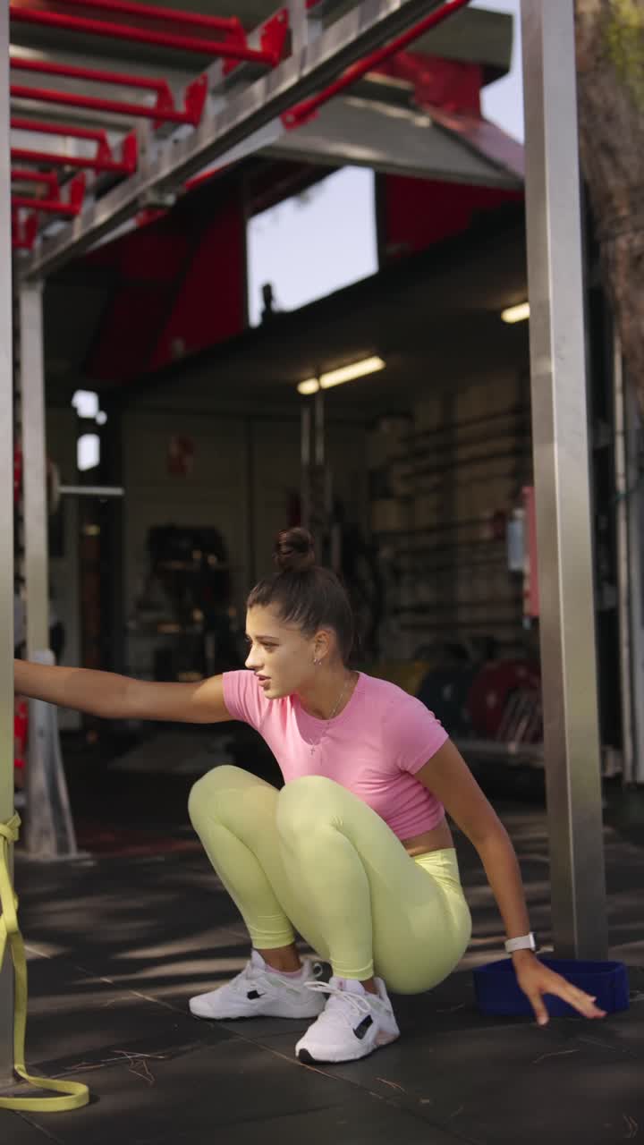Woman in activewear exercising outdoors
