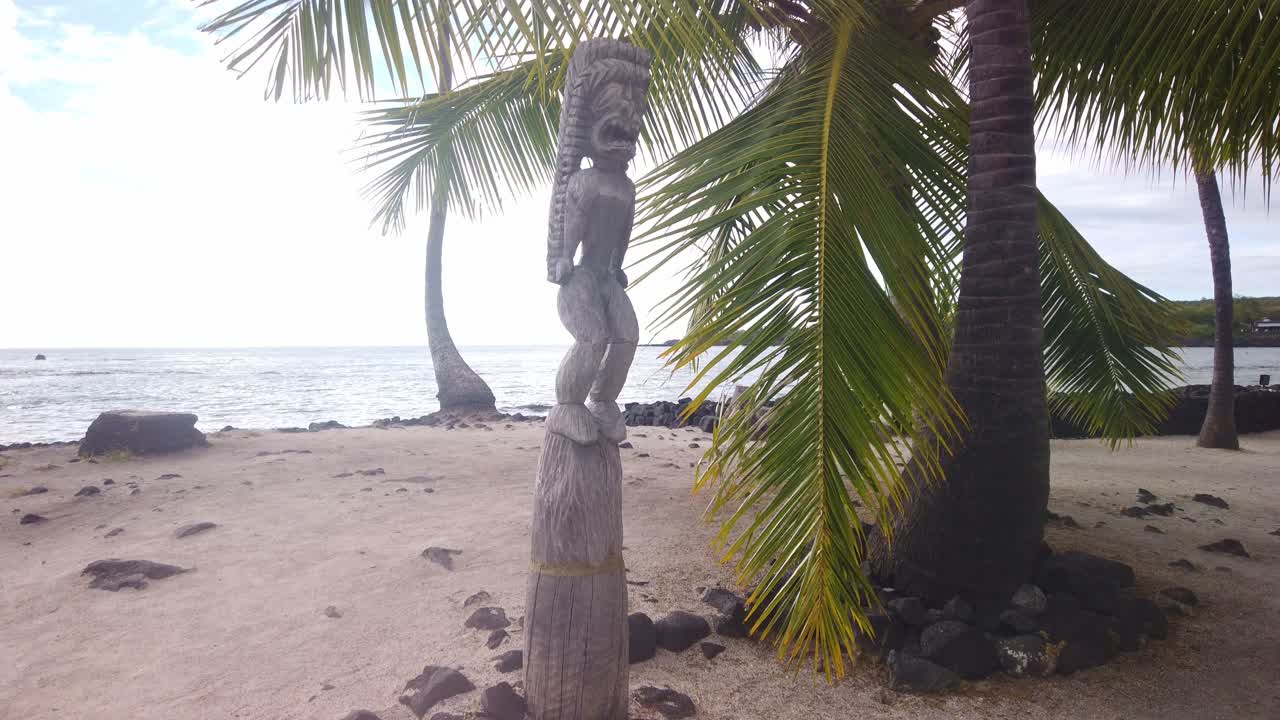 Gimbal booming up shot of a tiki statue at Pu'uhonua O Honaunau National Historical Park on the Big Island of Hawai'i