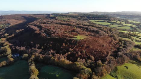 4k aerial slow descent over the mountains and beautiful green rolling hills of culmstock beacon in the blackdown hills of devon england