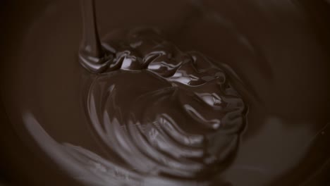 pouring melted dark bitter chocolate flow