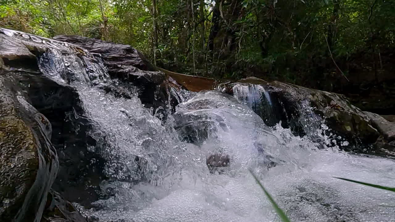 Slow motion, powerful sprays, dynamic water flow, serene nature sounds