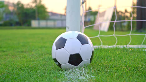 Soccer-ball-on-the-football-field--background