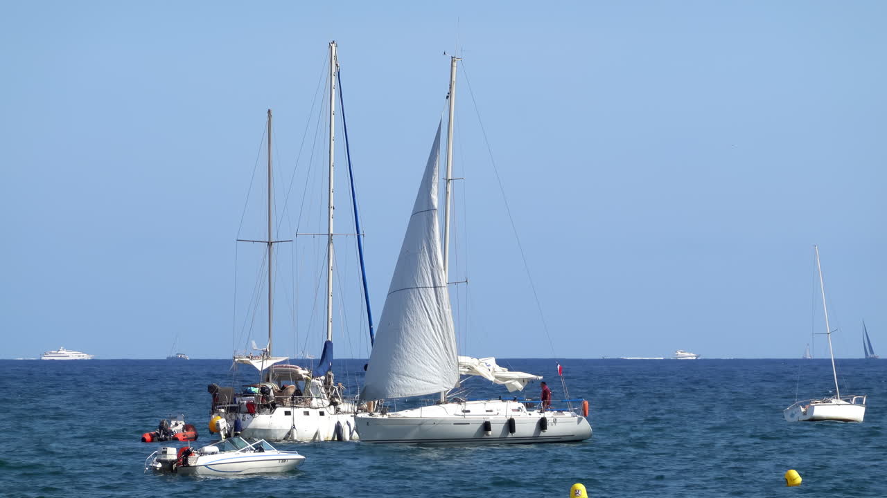 Boats moving on the sea in Golfe-Juan, France in daylight
