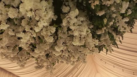 elegant white floral ceiling decor in a wedding tent at jardin villa cortés, morelos
