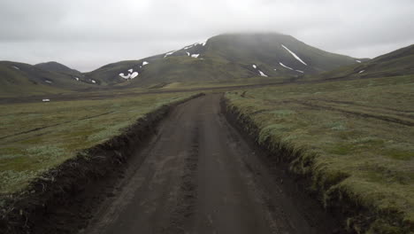 Off-road-car-vehicle-drive-on-dirt-road-to-Landmanalaugar-on-highlands-Iceland.