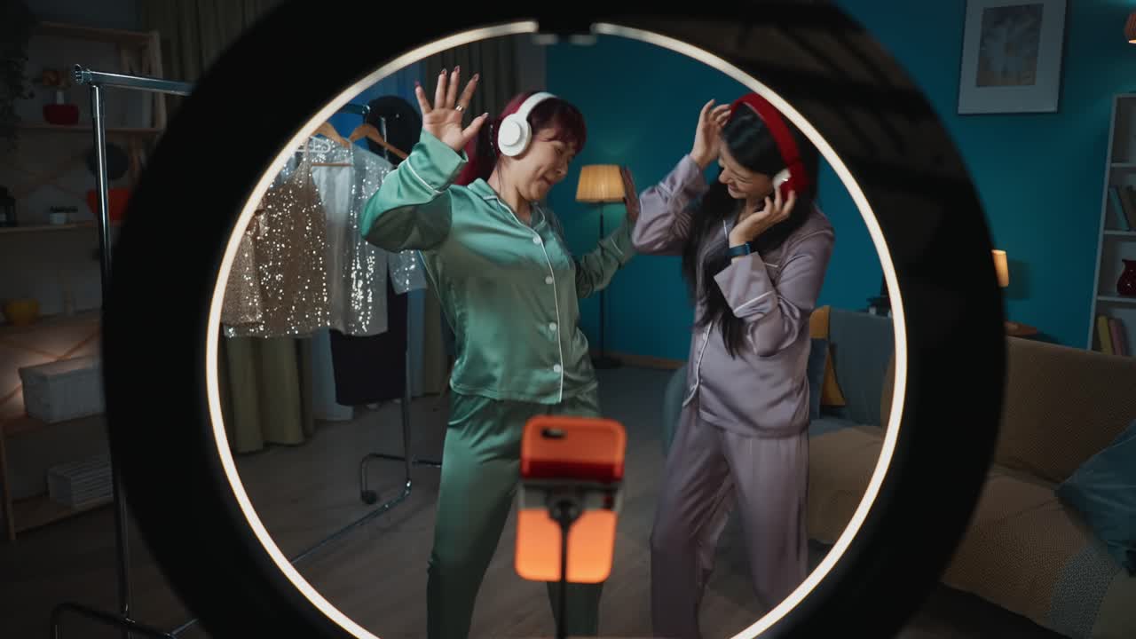 Two Women Dancing in Pajamas