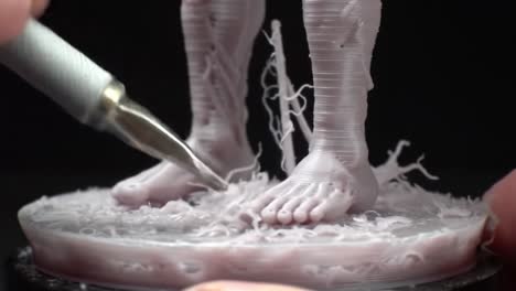 detailed craftsmanship in sculpting: a close-up of the artistry behind 3d printed figure with a focus on foot details, showcasing sculpting techniques and materials used