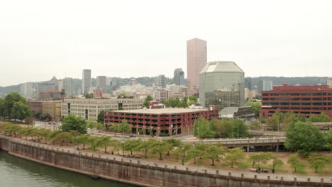 Low-circling-aerial-shot-of-Portland-Oregon-city-centre-skyscrapers