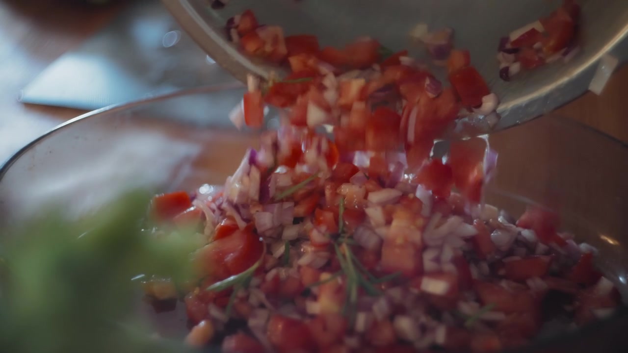 Salad being poured on the serving dish