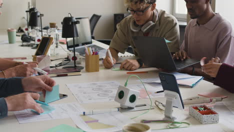diverse group collaborating and working together at an office desk