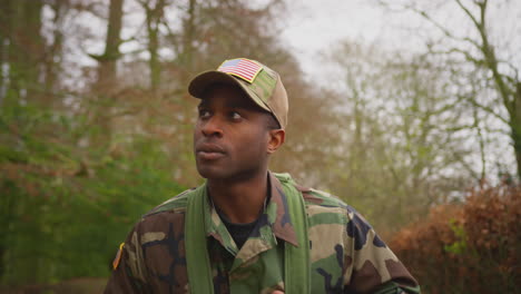 american soldier in uniform carrying kitbag returning home on leave