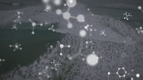 animation of falling molecules over seascape