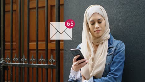 Woman-leaning-on-a-wall-near-the-door-while-texting-4k