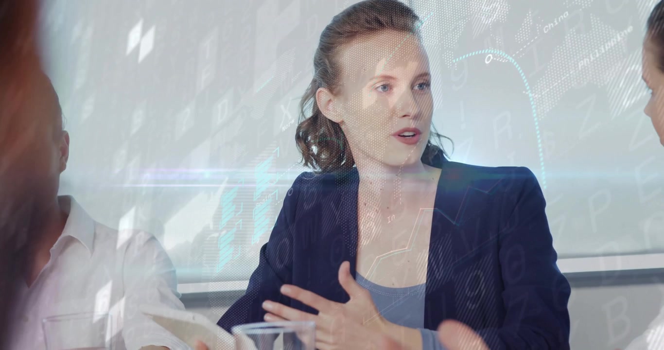 Woman leading business meeting after reviewing docs, man nodding as graphs animating across screen