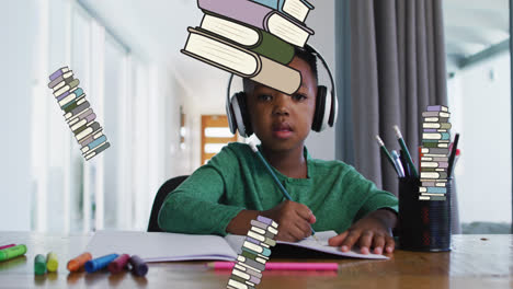 animation of school items over african american boy learning at home