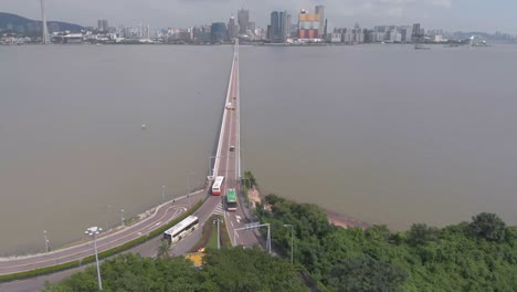 Aerial-drone-shot-tilt-reveal-of-Macau-skyline-and-Praia-Grande-bridge