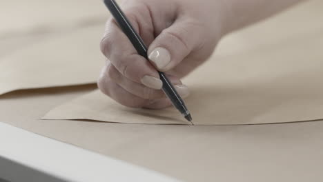 woman creating a clothing pattern