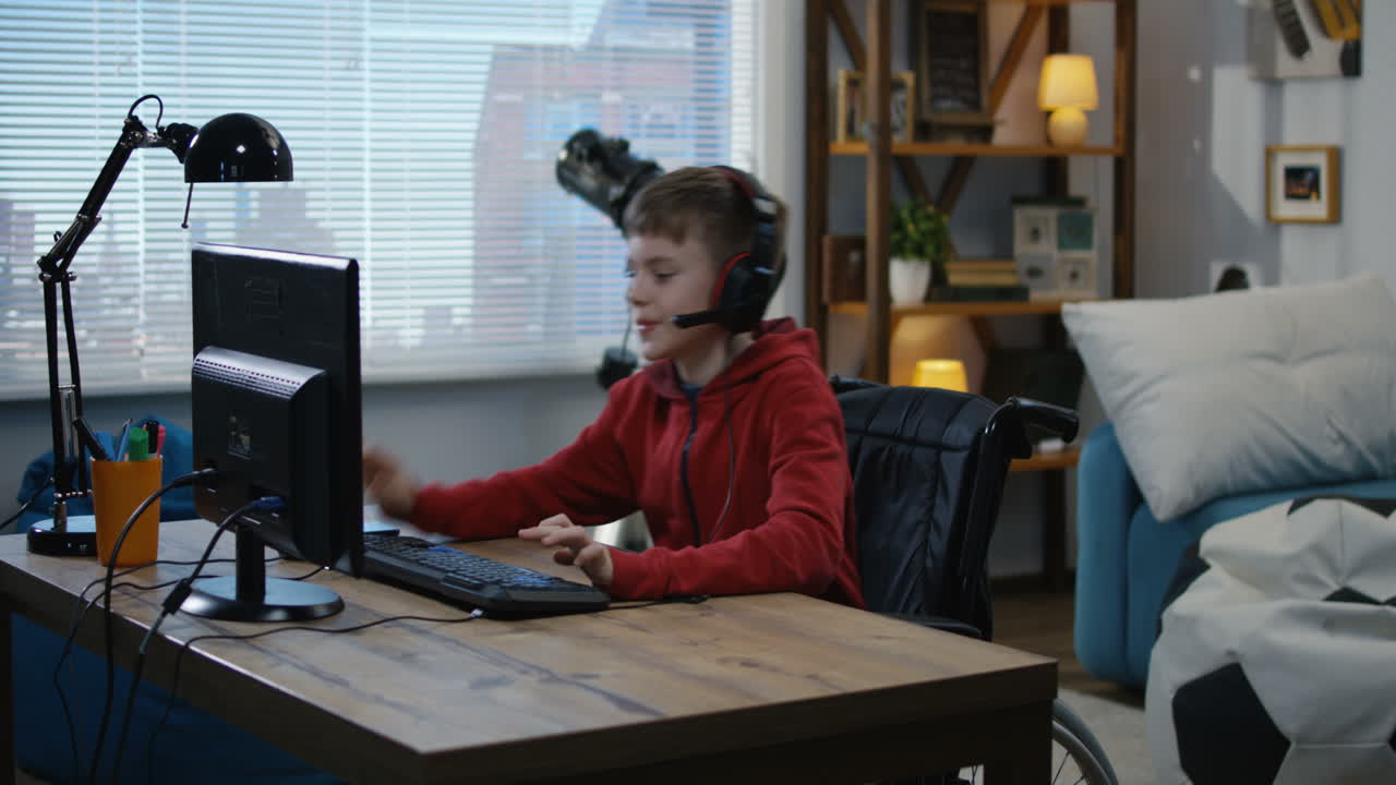 Boy in Wheelchair Gaming on Computer