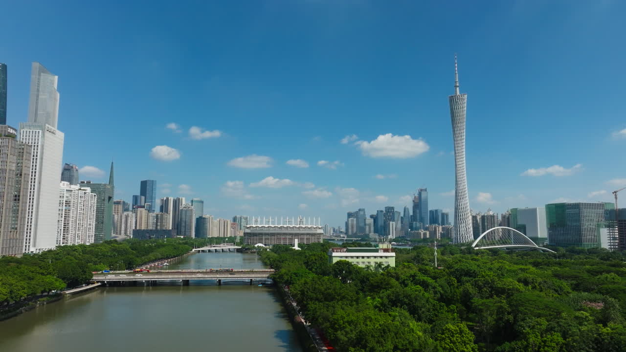 Downtown guangzhou, china with the iconic canton tower and pearl river., aerial view