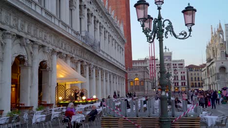 musicians on the front of the chairs in venice italy