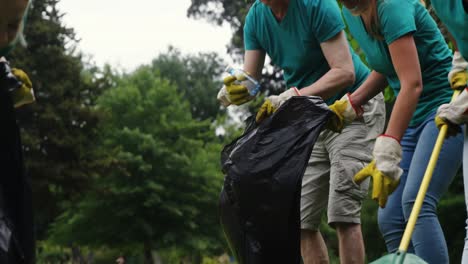 team of volunteers picking up litter