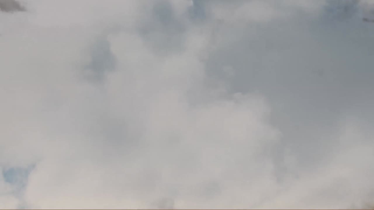 Animation of sky full of moving clouds