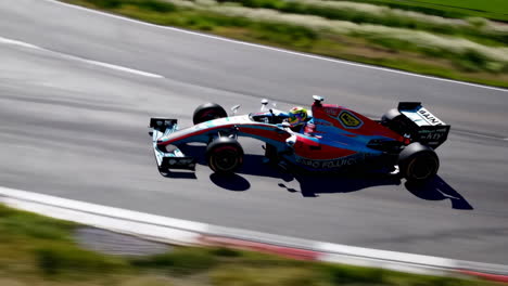 Formula 1 Car Racing on a Track
