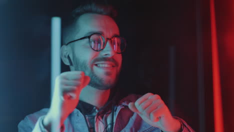 man dancing in neon light