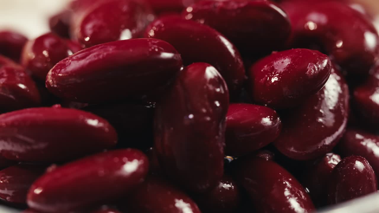 Canned red bans preserved beans rotating background close up side view. Organic steamed beans. Pickled bean for a Mexican dish